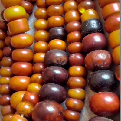 Several ropes of very old bakelite (phenolic resin) beads, probably produced in Germany in the 1920-40's. Very popular in North- and West-Africa with Berber and Fulani tribes. Used as an imitation of amber.