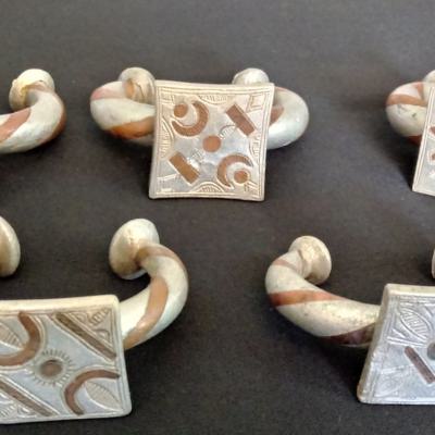 A collection of well-used aluminium bracelets, inlaid with copper for an extra decoration. Fulani,Mali.