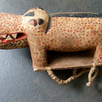 Wooden hippo, worn on the back, during processions and carnavals. Painted and with straps. Bidjogo, Guineé-Bissau.L 52 cm. On steel socle.